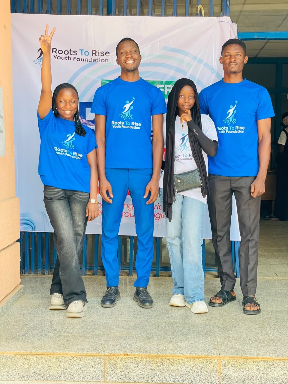 The RootsToRise volunteer team in branded shirts at Bootcamp 1.0